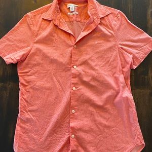 Calvin Klein button up shirt,Color pink, And is size small kids